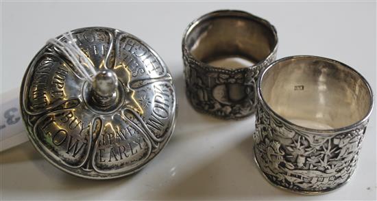 2 white metal napkin rings & spinning top